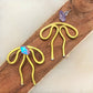 Coquette Bow: Hand-formed aluminum wire earring jackets