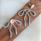 Coquette Bow: Hand-formed aluminum wire earring jackets